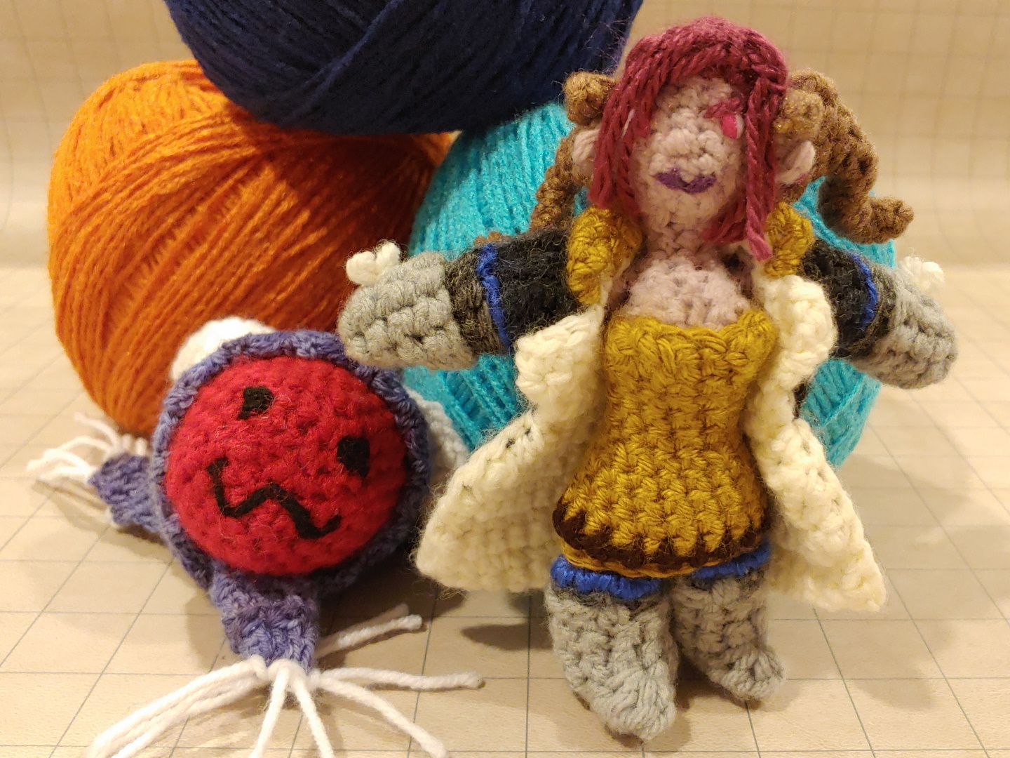 Amigurumi doll of my OC Astraea Helbourne, a half-succubus woman, in her standard paladin gear.