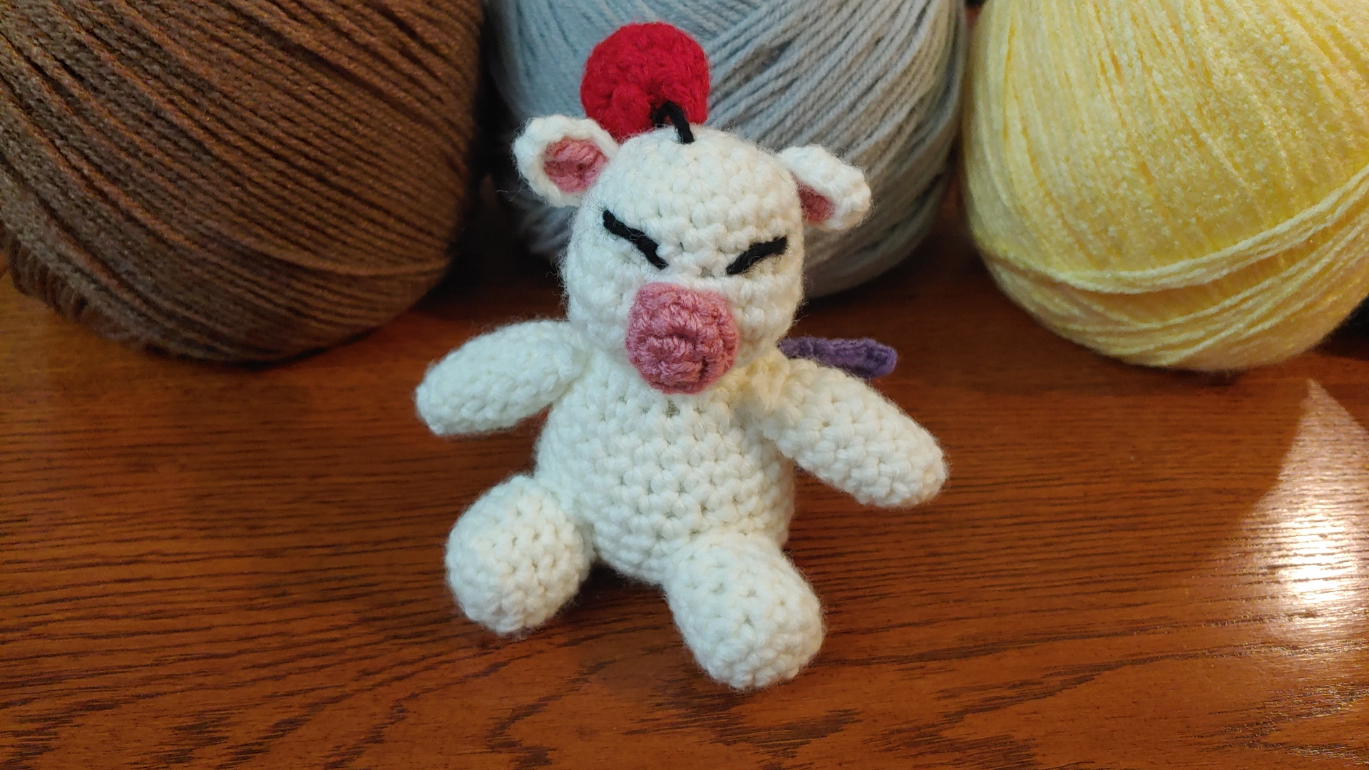 Amigurumi moogle from Final Fantasy.